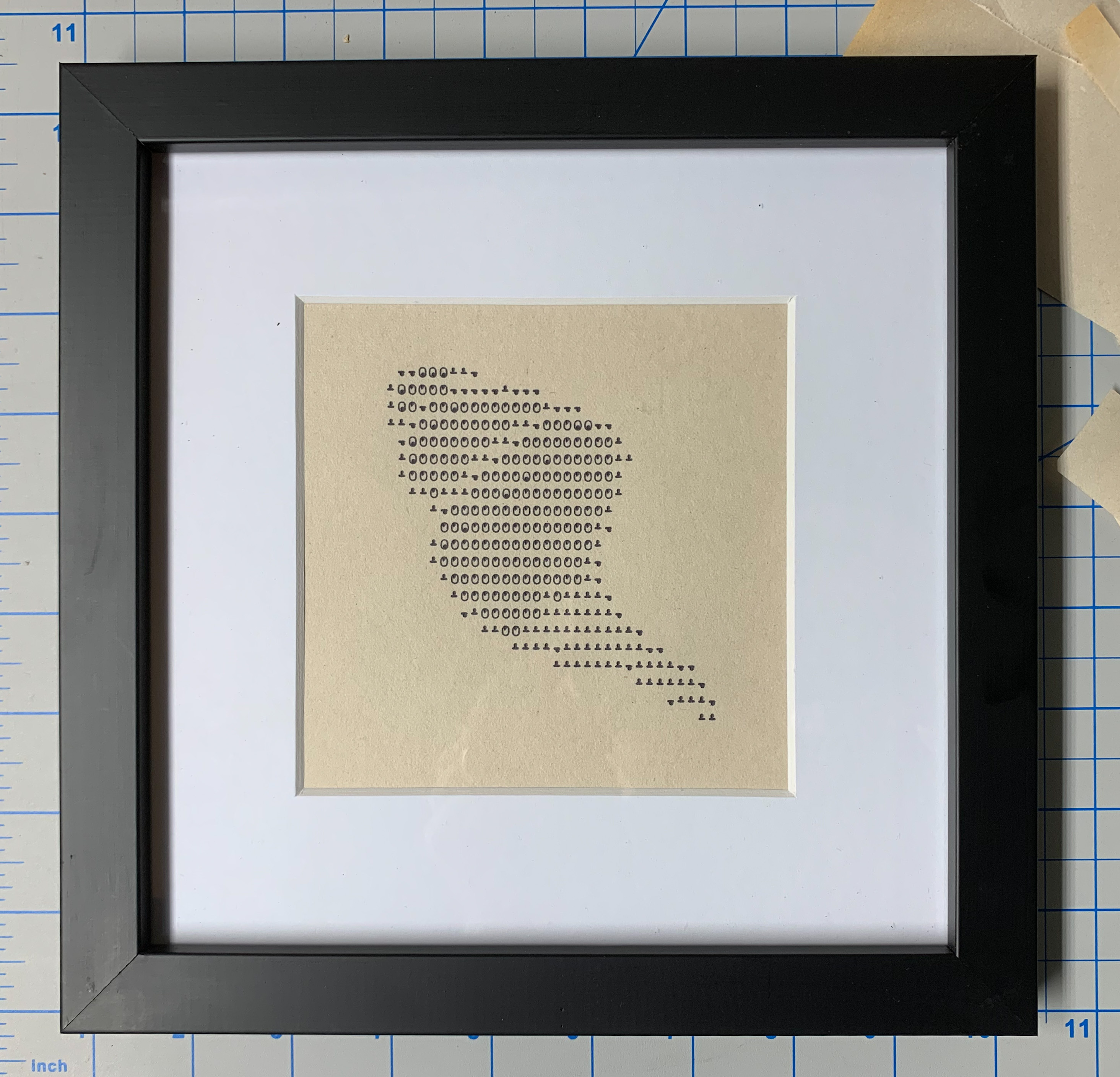 Shell emoji printed in overstrike on Teletype, framed
